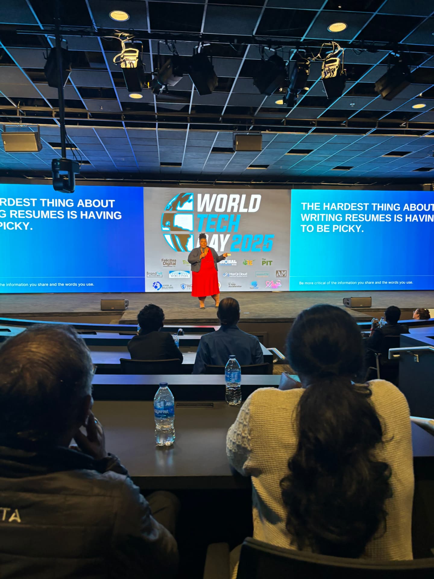 Speaker presenting on stage at World Tech Day 2025